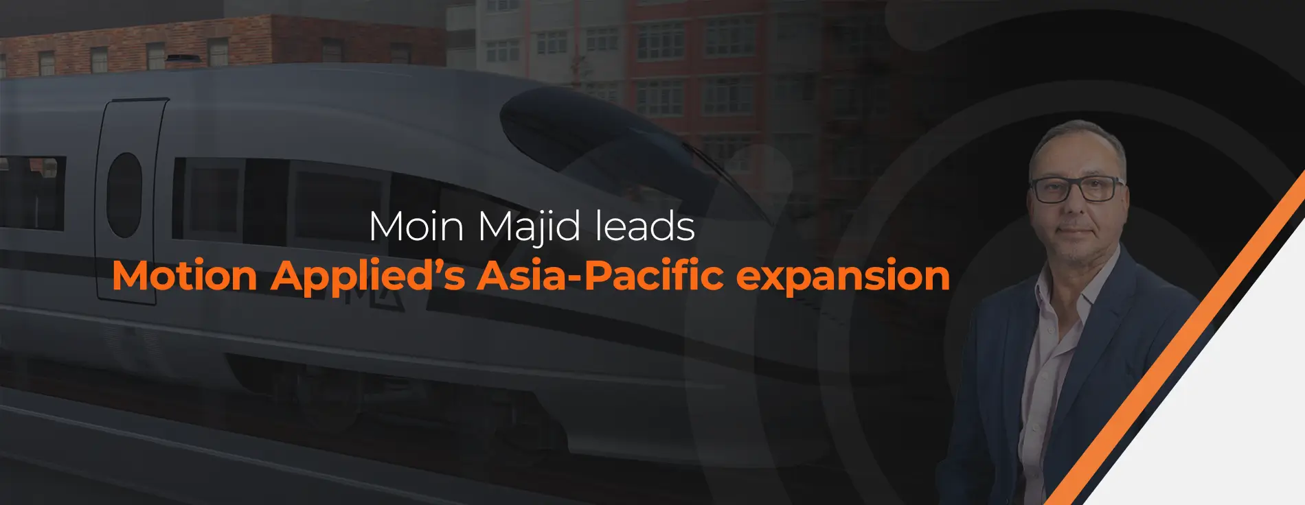 Logo with an orange circular design on the left and the words “MOTION APPLIED” in bold white uppercase letters on a dark gray background.