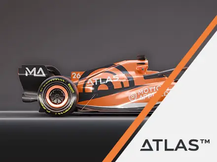 Side view of an orange and black new generation Formula 1 car with branded graphics, shown against a dark studio background.