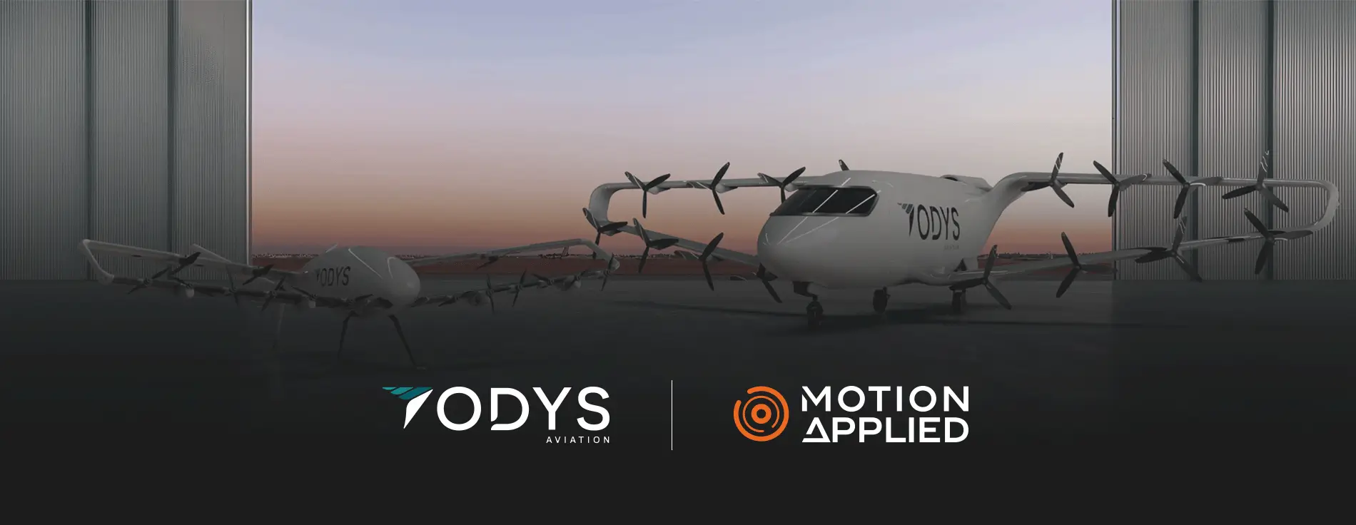 Two white electric aircraft with multiple rotors, branded ‘ODYS,’ positioned inside a hangar at sunset, with one larger aircraft and a smaller companion vehicle shown side by side.