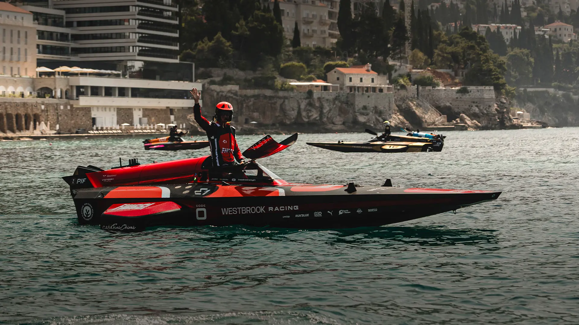 Sport awards logo with images of a Formula 1 car and laptop screen behind